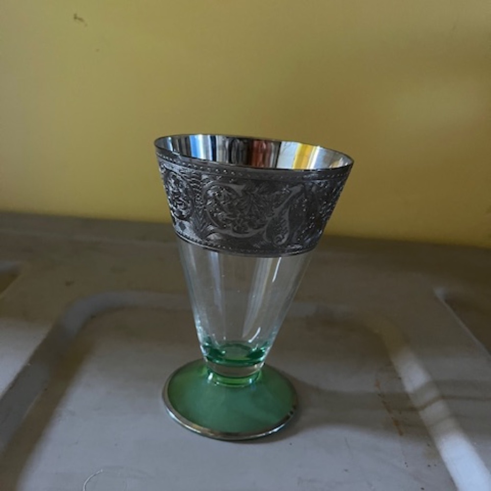 Vintage green tinted glass with metal rim detail